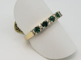 14kt yellow gold ring with natural emeralds and diamonds